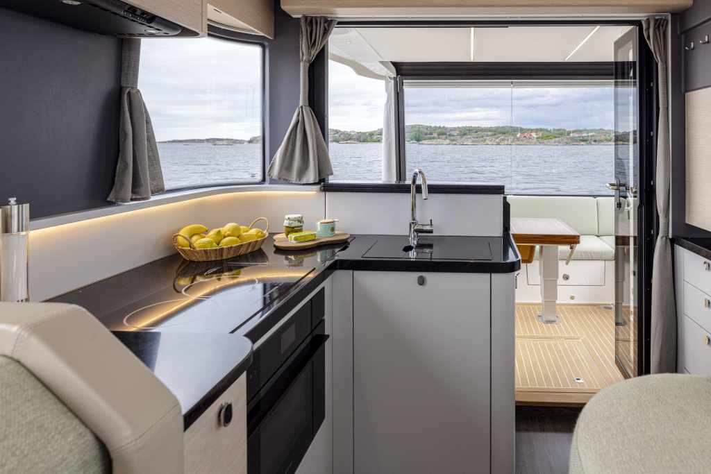 Introducing the Nimbus Flybridge 495 Nimbus flybridge 495 new coupé passenger flow on the Nimbus flybridge 495 Large glass windows on the Nimbus flybridge 495 Kitchen onboard the Nimbus flybridge 495 Nimbus flybridge 495 coupé’s salon