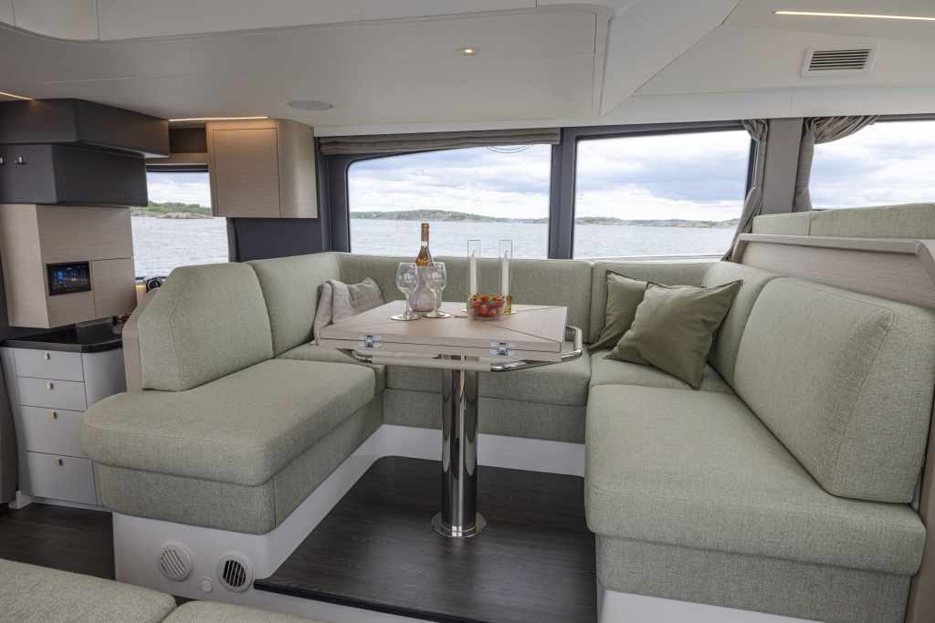 Introducing the Nimbus Flybridge 495 Nimbus flybridge 495 new coupé passenger flow on the Nimbus flybridge 495 Large glass windows on the Nimbus flybridge 495 Kitchen onboard the Nimbus flybridge 495 Nimbus flybridge 495 coupé’s salon